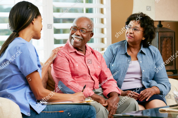 Care worker supporting an older adult living with dementia at home